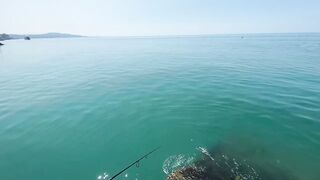 Новый Афон жара и пирс дневная рыбалка в тени навеса