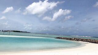 Huraa Island, Maldives: канал, лодки-дони и вечерние силуэты пальм