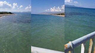 Polis, Cyprus — Limni Pier: спокойная гладь, камни волнореза и вечерняя удочка