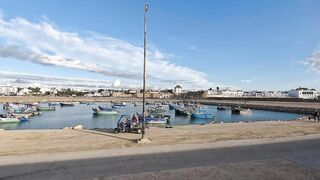 Asilah, Morocco - приморский променад и рыбалка на закате