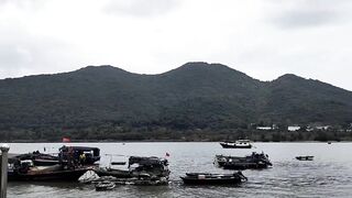 Хайнань, Ялунвань: рыбацкий порт — разгрузка неводов и аукцион