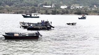 Хайнань, Ялунвань: рыбацкий порт — разгрузка неводов и аукцион