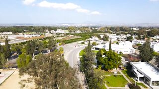 Гюзельюрт районы Северного Кипра спокойная жизнь на холмах цитрусовые сады и бирюзовое море рядом