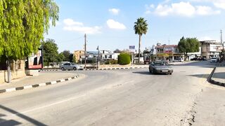 Гюзельюрт районы Северного Кипра спокойная жизнь на холмах цитрусовые сады и бирюзовое море рядом