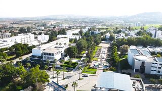 Гюзельюрт районы Северного Кипра спокойная жизнь на холмах цитрусовые сады и бирюзовое море рядом