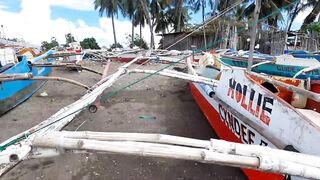 В Talisay Cebu море и рыба по настоящему свежие рыбачим сетями прямо у берега города