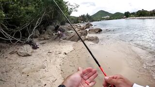 Спиннинг в Китае остров Хайнань береговая рыбалка по морскому хищнику у камней