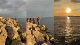 Рыбалка на Чёрном море в Сириусе длинный пирс каменный волнорез и уверенный вечерний клев